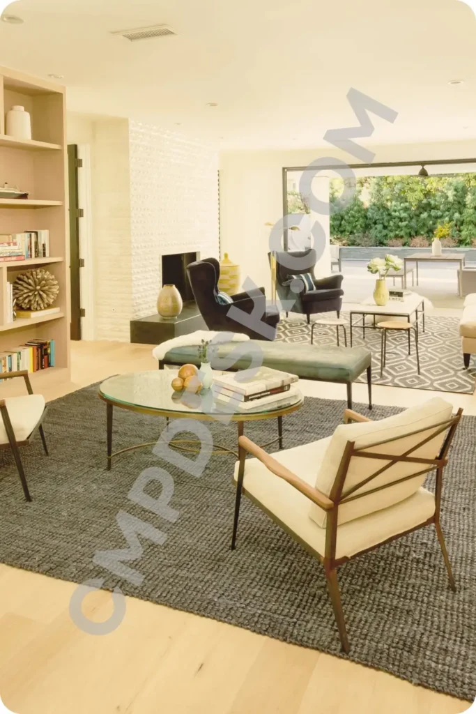 A four-quadrant interior collage showing various styled living spaces utilizing distinct patterned area rugs to anchor furniture arrangements and define room boundaries.